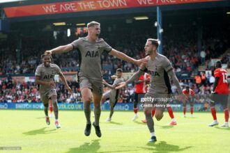 Resilient Tottenham go top of the league