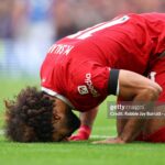 Mohammed Salah's double sends Liverpool top