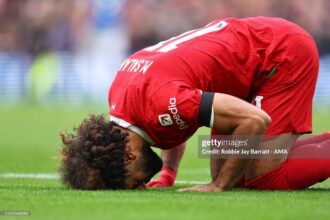 Mohammed Salah's double sends Liverpool top