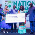 Charity Akortia recieving her cheque